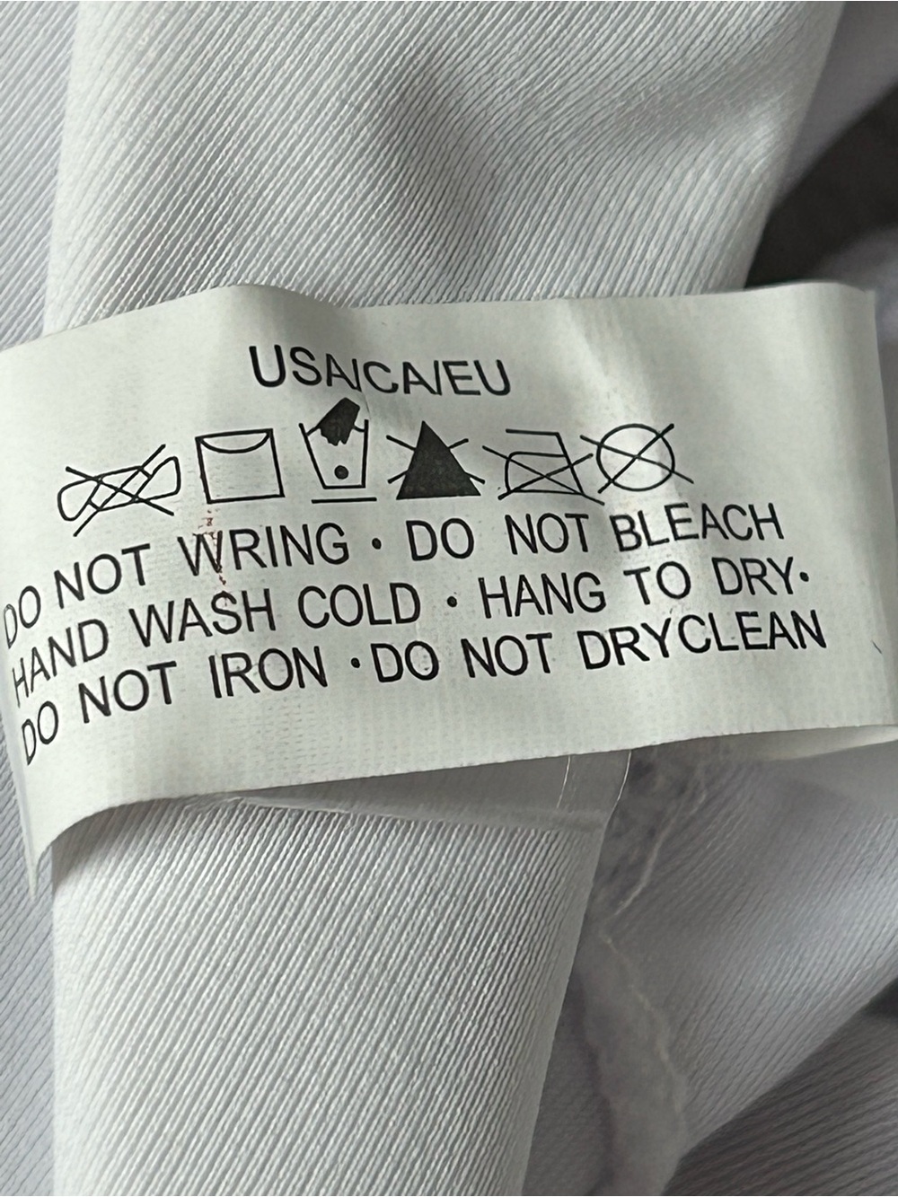 White Garment with Care Instruction Tag - Picture 5 of 8